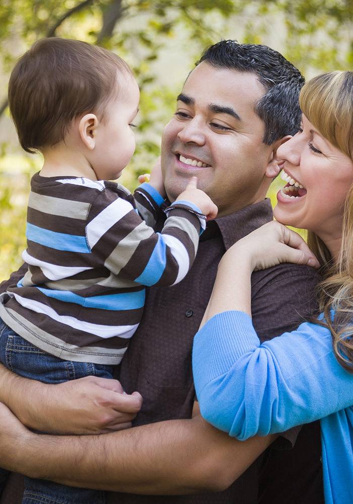 Parents smiling at child